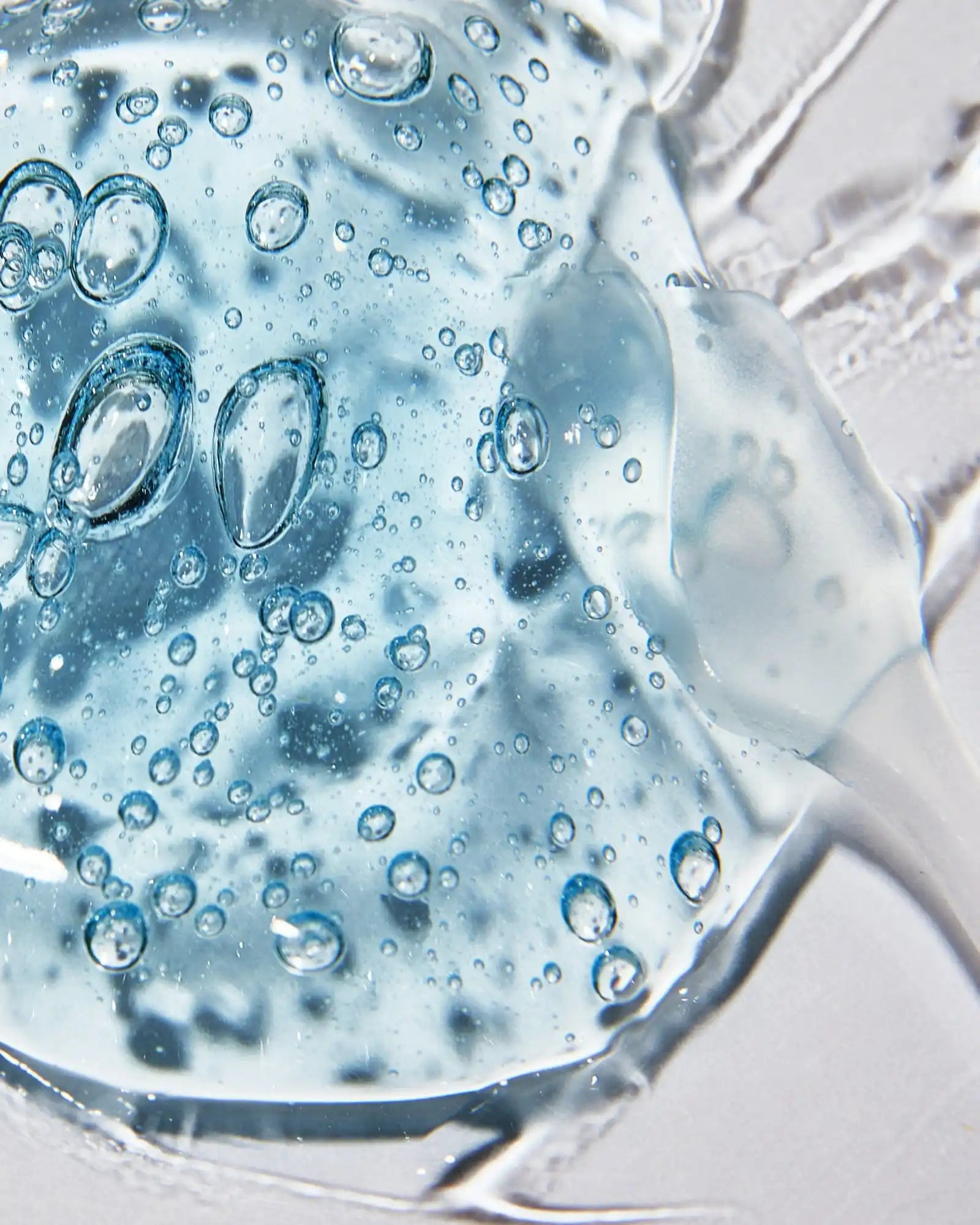 Translucent blue gel with air bubbles.